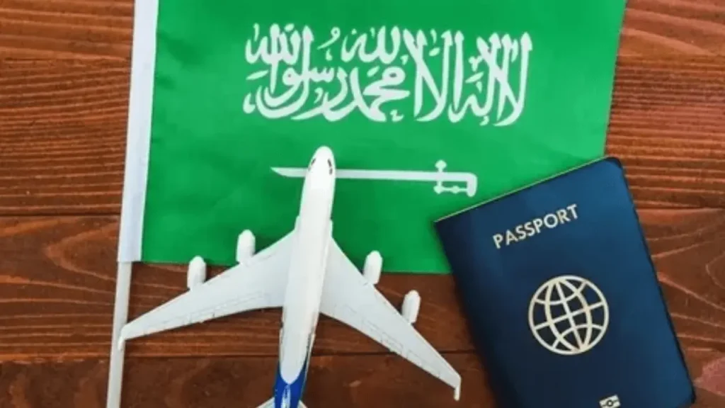 Freelance visa application process in Saudi Arabia with a laptop and Saudi skyline.