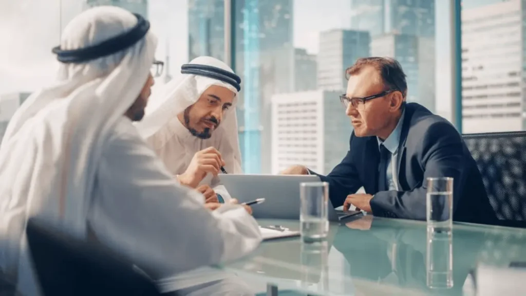 Foreign investor meeting with local Saudi manager to assign management without transferring ownership in Saudi Arabia.